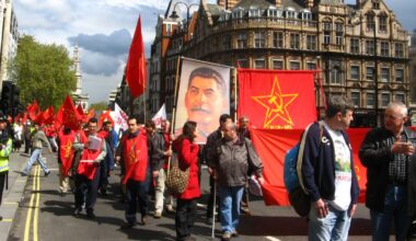 A contingent from the Communist Party of Great Britain (Marxist–Leninist) carrying a banner of Stalin at a May Day march.